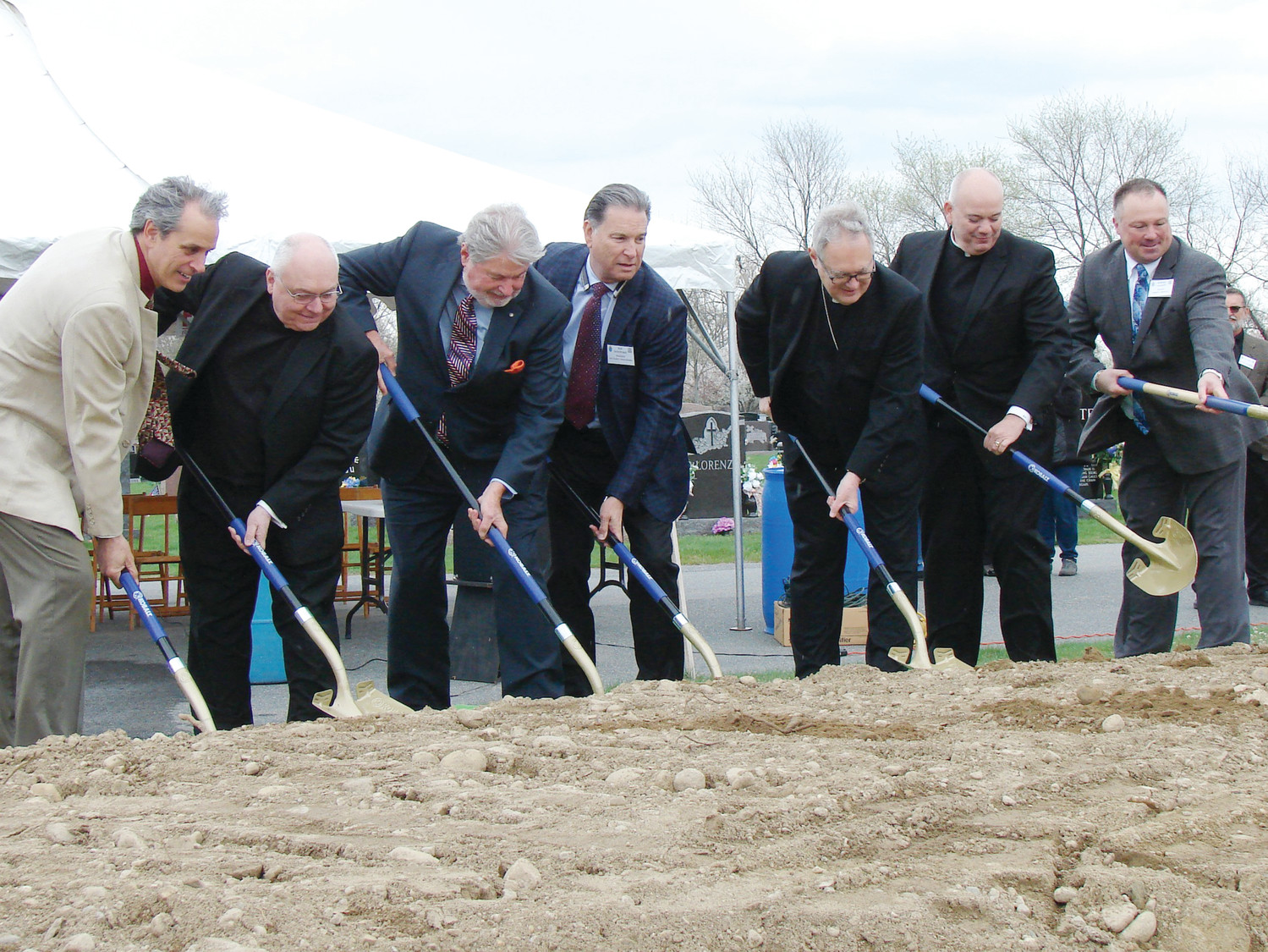 Dignitaries break ground for the new mausoleum at St. Ann Cemetery, Cranston. From left to right, Michael Sabatino, Msgr. Raymond Bastia, Larry Jones, Bob DeBeltrand, Bishop Thomas J. Tobin, Father William Ledoux and Anthony Carpinello.